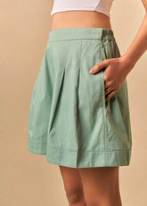 A Model Wearing Green Organic Cotton The Ocean Tide organic cotton shorts, curated by Only Ethikal